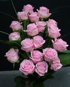 20 pink roses in a tall arrangement